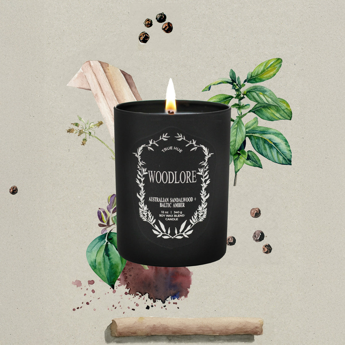 Woodlore Candle on a beige background with peppercorns, a cinnamon stick and leaves surrounding the candle.